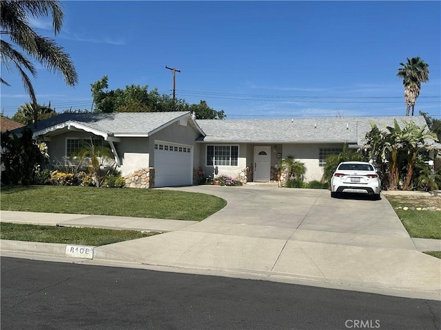 ranch-style home with a front yard, a garage, concrete driveway, stucco siding, and a shingled roof