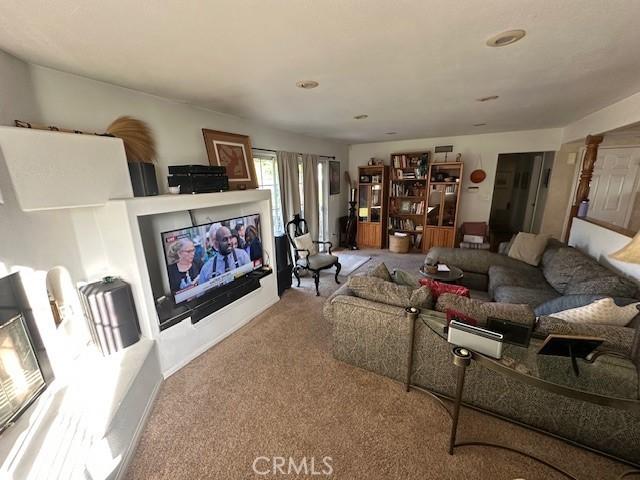 living room featuring carpet floors and recessed lighting
