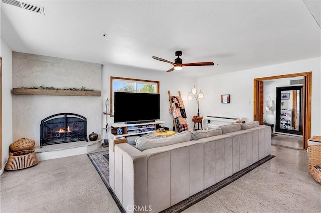 33645 Kobe Rd, Agua Dulce, CA 91390 - living room featuring a ceiling fan, a lit fireplace, and speckled floor