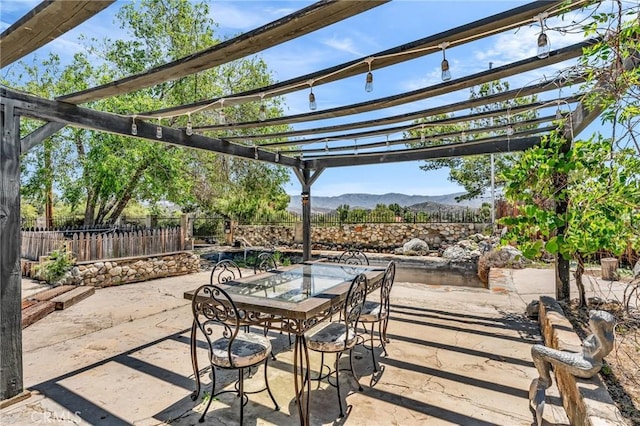 33645 Kobe Rd, Agua Dulce, CA 91390 - view of patio with fence, a mountain view, a pergola, and outdoor dining space