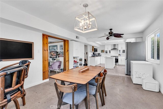 33645 Kobe Rd, Agua Dulce, CA 91390 - dining space featuring a chandelier, baseboards, ceiling fan, and concrete flooring
