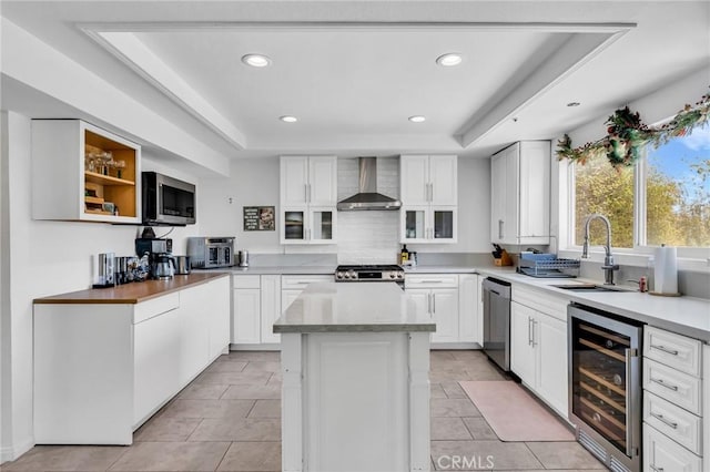 33645 Kobe Rd, Agua Dulce, CA 91390 - kitchen with beverage cooler, wall chimney exhaust hood, a sink, a tray ceiling, and recessed lighting