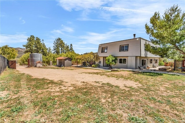 33645 Kobe Rd, Agua Dulce, CA 91390 - back of house with a storage shed, an outdoor structure, and a patio area