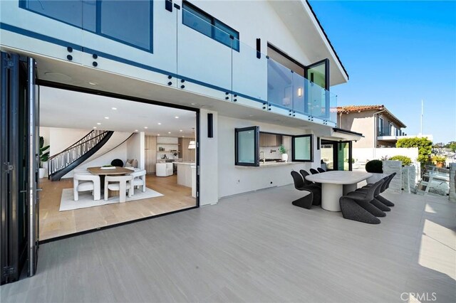 view of patio / terrace with stairs and outdoor dining space