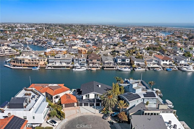 aerial perspective of suburban area featuring a nearby body of water