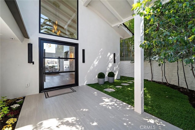 entrance to property with stucco siding