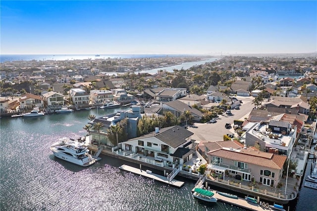 aerial view of residential area featuring a nearby body of water
