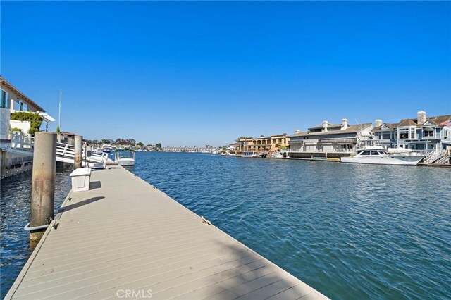 dock featuring a water view and a residential view