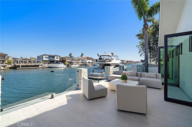 exterior space with a water view, outdoor lounge area, and a residential view