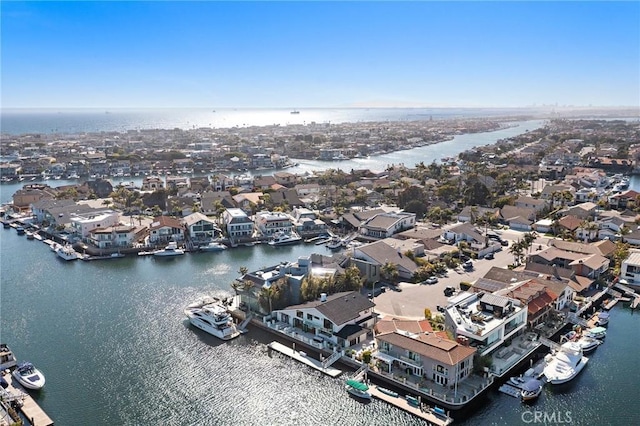 aerial perspective of suburban area featuring a large body of water