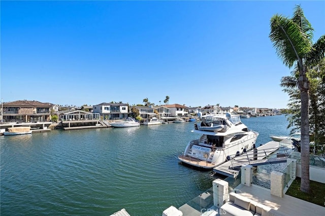 dock area with a water view and a residential view