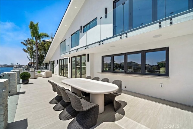 view of patio featuring outdoor dining area