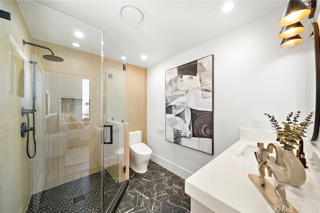 full bath featuring recessed lighting, toilet, a shower stall, vanity, and marble finish flooring