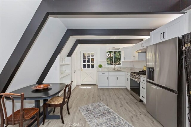 323 Mittry Ln, Lake Arrowhead, CA 92352 - kitchen with appliances with stainless steel finishes, white cabinetry, light wood finished floors, light countertops, and a sink