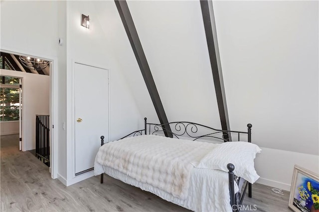 323 Mittry Ln, Lake Arrowhead, CA 92352 - bedroom featuring light wood-type flooring, a chandelier, and baseboards