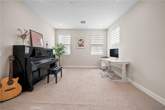 home office with light colored carpet and baseboards
