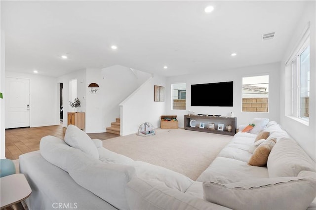 16708 Yarrow Ln, Fontana, CA 92336 - living room with stairway, recessed lighting, wood finished floors, and healthy amount of natural light