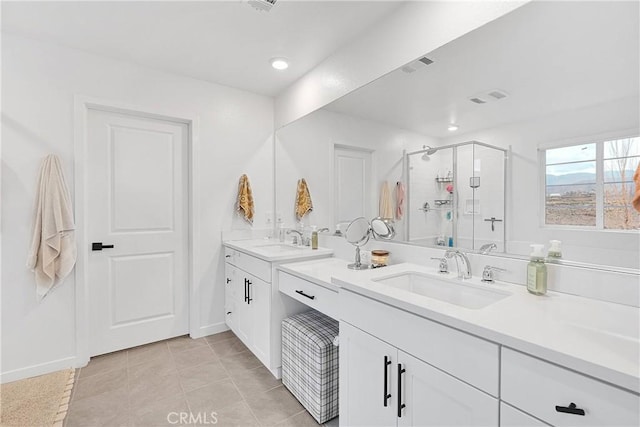 16708 Yarrow Ln, Fontana, CA 92336 - bathroom with a stall shower, tile patterned floors, baseboards, vanity, and recessed lighting