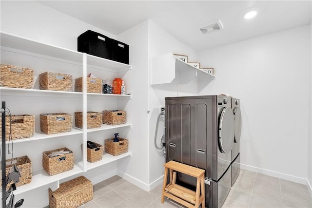 16708 Yarrow Ln, Fontana, CA 92336 - laundry room featuring washing machine and dryer, light tile patterned floors, and baseboards
