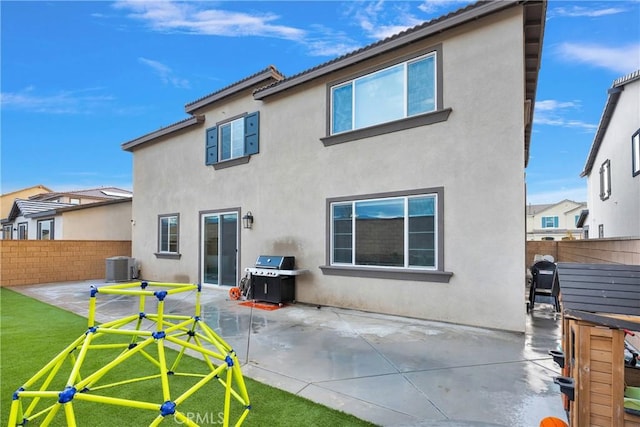 16708 Yarrow Ln, Fontana, CA 92336 - back of house with stucco siding, a patio area, and central AC