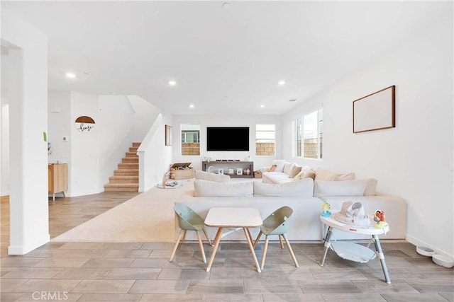 16708 Yarrow Ln, Fontana, CA 92336 - living room featuring recessed lighting, stairs, wood finished floors, and baseboards