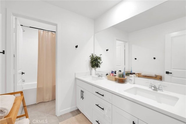 16708 Yarrow Ln, Fontana, CA 92336 - full bath with tile patterned floors, double vanity, shower / bath combo, and baseboards