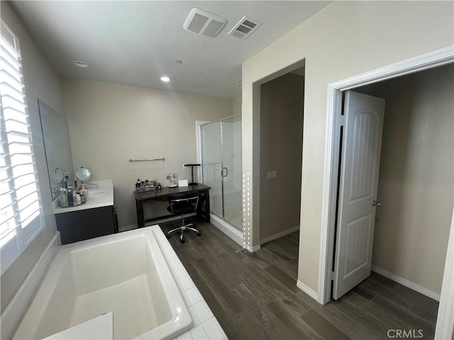 320 E Costera Ct, Placentia, CA 92870 - bathroom featuring a stall shower, wood finished floors, vanity, a garden tub, and recessed lighting