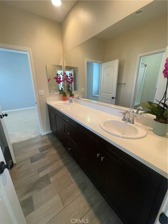 320 E Costera Ct, Placentia, CA 92870 - bathroom with double vanity, wood finish floors, and recessed lighting