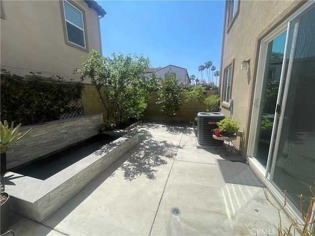 320 E Costera Ct, Placentia, CA 92870 - view of patio featuring central AC and a fenced backyard