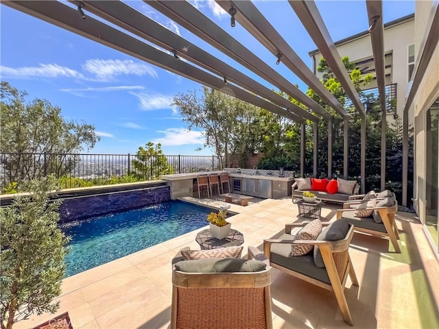 view of pool with an outdoor hangout area, a pergola, a fenced backyard, a patio, and exterior kitchen