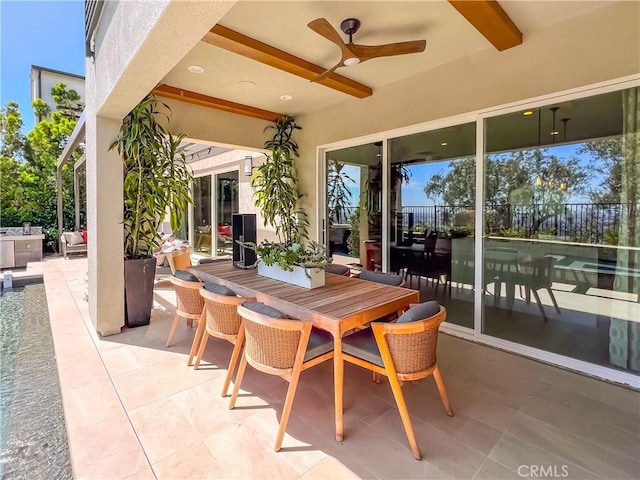 view of patio / terrace featuring ceiling fan, outdoor dining space, and fence
