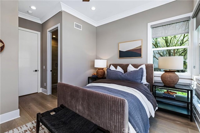 bedroom with multiple windows, crown molding, wood finished floors, baseboards, and recessed lighting