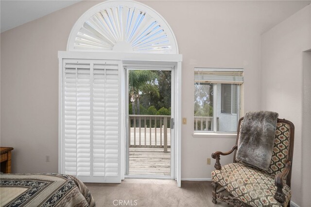 carpeted bedroom featuring access to outside and baseboards