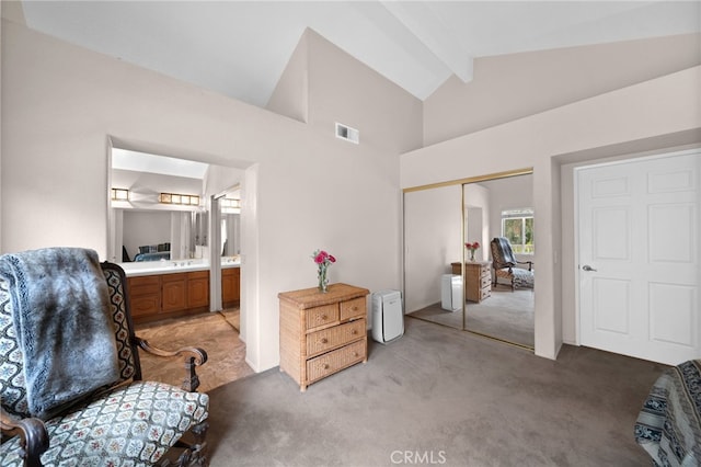 sitting room featuring light colored carpet, beamed ceiling, and high vaulted ceiling