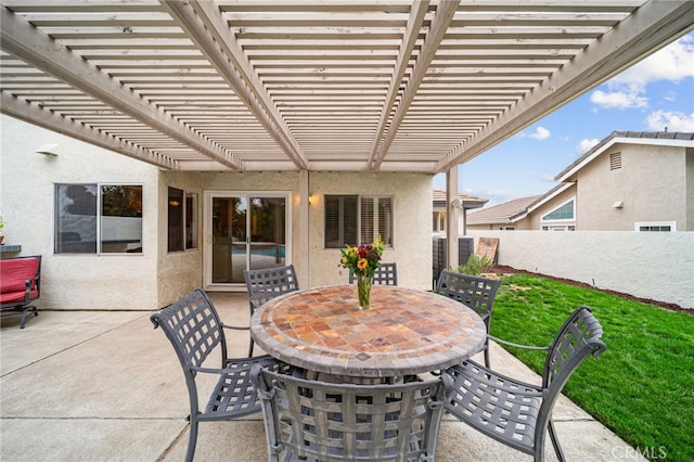 view of patio featuring a pergola and outdoor dining area