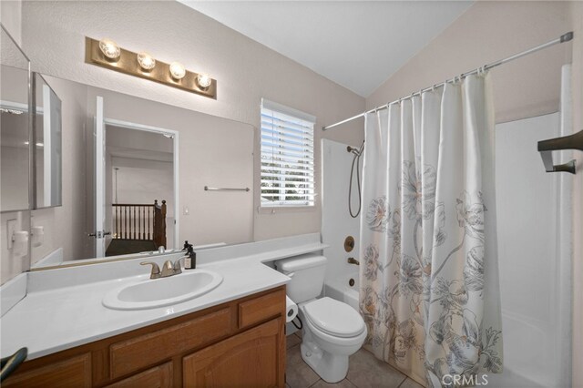 bathroom featuring shower / tub combo, vanity, toilet, tile patterned floors, and vaulted ceiling