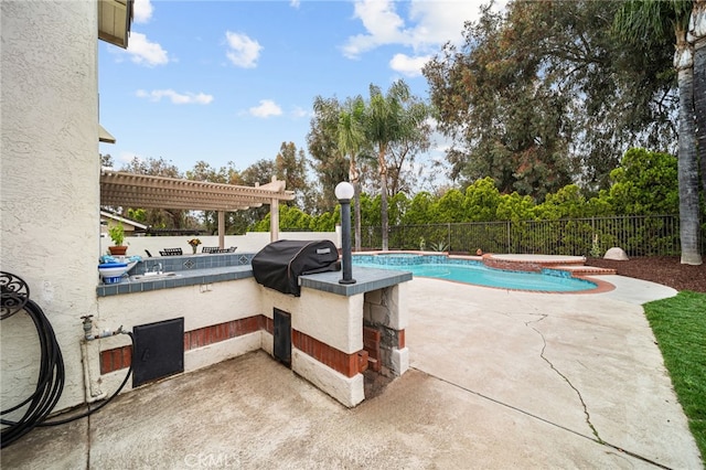 view of pool featuring exterior kitchen, a fenced backyard, a pergola, and a patio