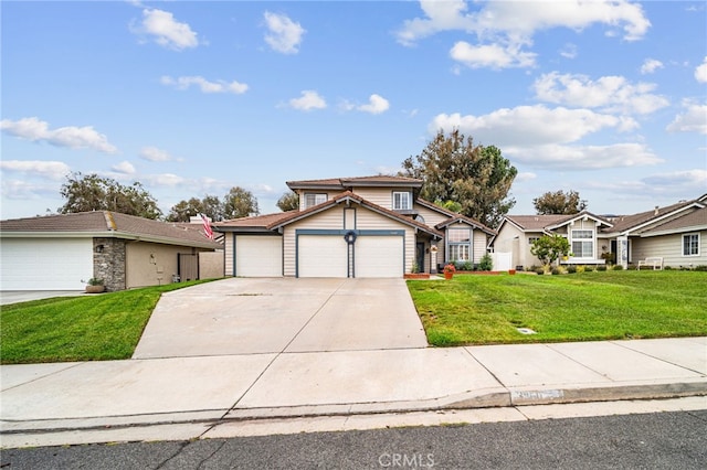 traditional home with a front yard, a garage, and concrete driveway