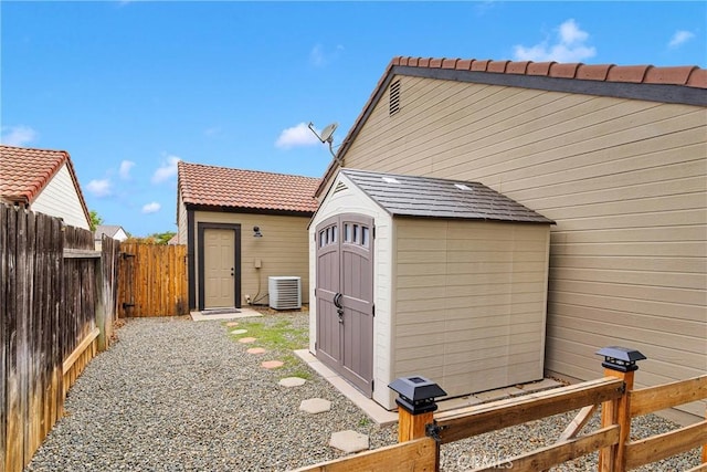 6154 Goldenrod Ln, Riverside, CA 92504 - view of shed with central AC and a fenced backyard