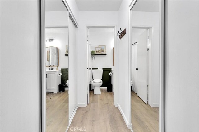 6154 Goldenrod Ln, Riverside, CA 92504 - hall featuring light wood-style flooring and a sink