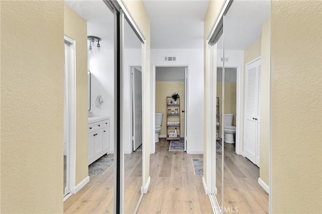 6154 Goldenrod Ln, Riverside, CA 92504 - hall with light wood-type flooring and a textured wall