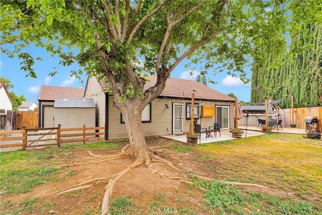 6154 Goldenrod Ln, Riverside, CA 92504 - back of house with a tiled roof and a patio area