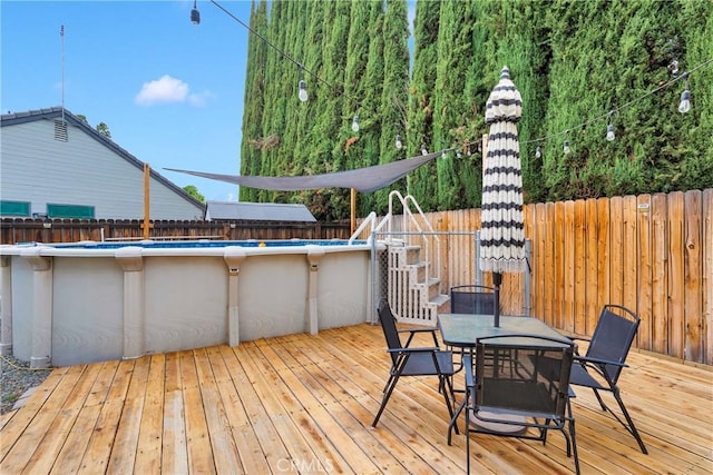 6154 Goldenrod Ln, Riverside, CA 92504 - deck with a fenced backyard and outdoor dining area