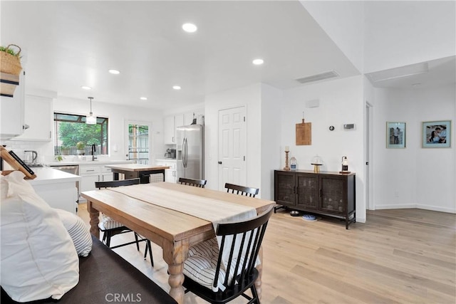 6154 Goldenrod Ln, Riverside, CA 92504 - dining space with light wood finished floors and recessed lighting
