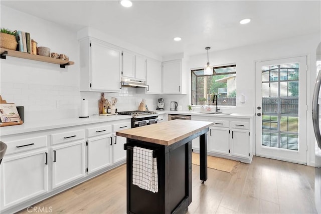 6154 Goldenrod Ln, Riverside, CA 92504 - kitchen with a sink, appliances with stainless steel finishes, under cabinet range hood, white cabinets, and recessed lighting