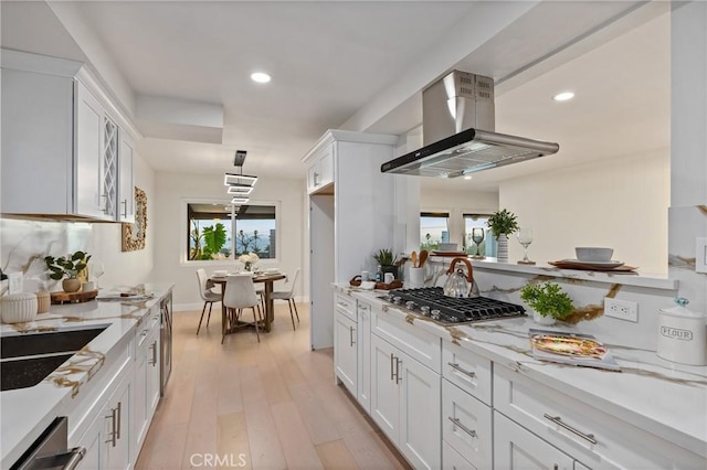 1741 Perch St, San Pedro, CA 90732 - kitchen featuring island range hood, stainless steel appliances, white cabinetry, plenty of natural light, and recessed lighting
