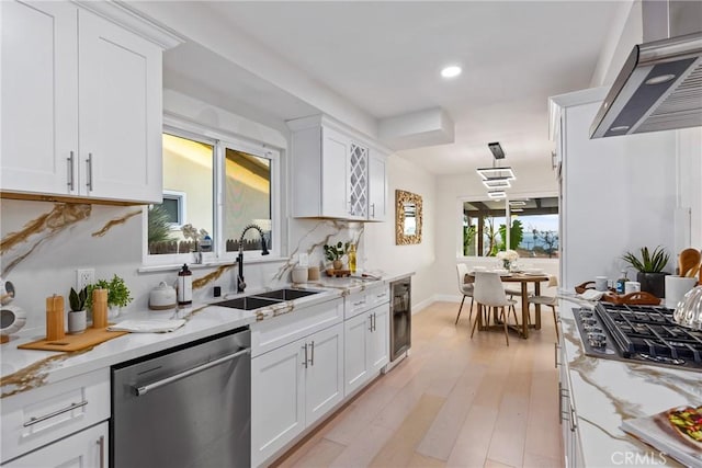 1741 Perch St, San Pedro, CA 90732 - kitchen with stainless steel appliances, a sink, wall chimney range hood, recessed lighting, and white cabinets