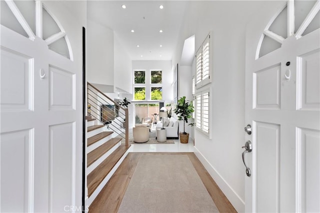 1225 Via Presa, San Clemente, CA 92672 - entrance foyer with stairs, wood finished floors, recessed lighting, baseboards, and a towering ceiling