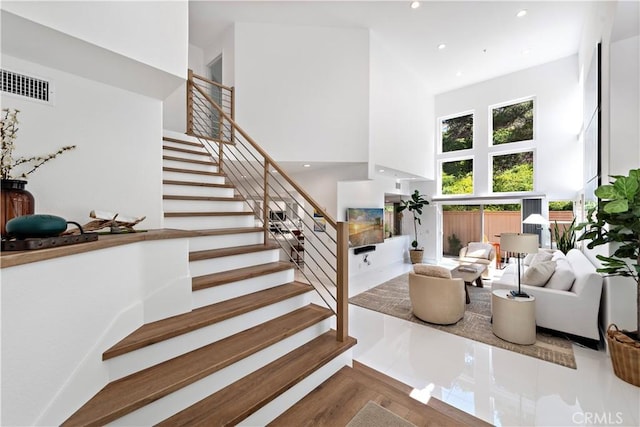 1225 Via Presa, San Clemente, CA 92672 - staircase featuring a high ceiling, recessed lighting, and wood finished floors