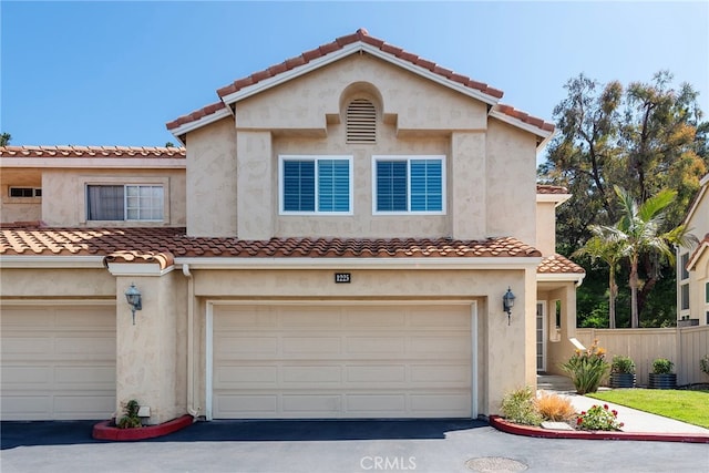 1225 Via Presa, San Clemente, CA 92672 - view of front of house with an attached garage, fence, driveway, and a tile roof